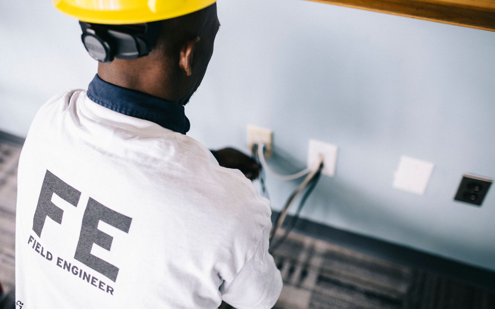 Surge Electric technician working on home electrical wiring